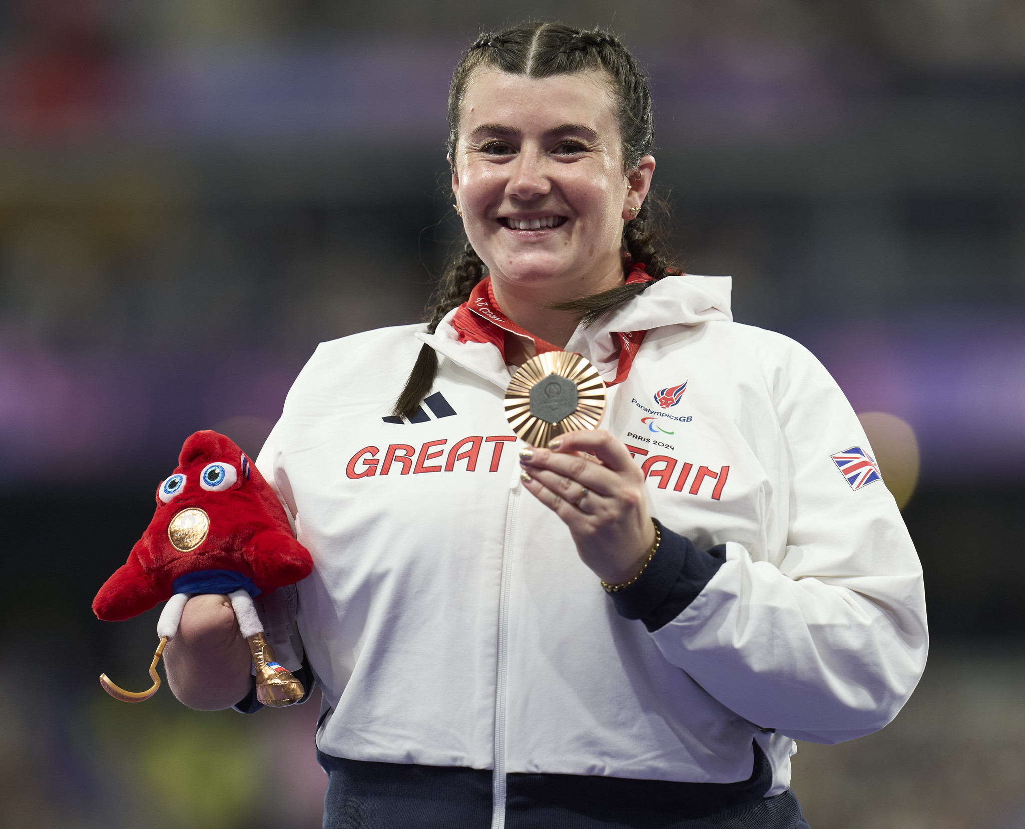 Hollie Arnold celebrating her bronze medal